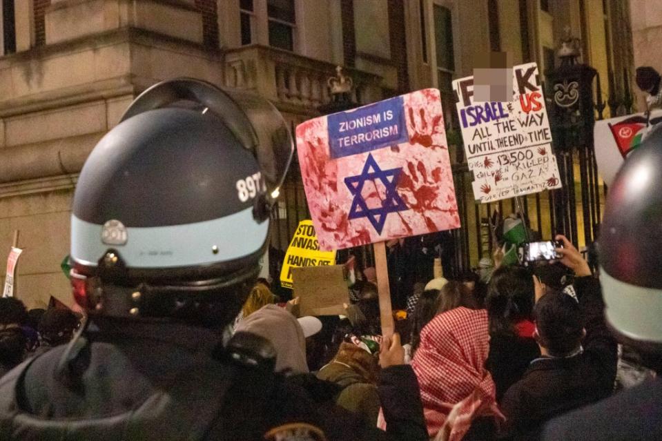 Police enter an area where fenced off Pro-Palestinian protesters gather and arrrested at least one person near 1165h St Amsterdam Ave near Columbia University on Saturday evening. William Miller