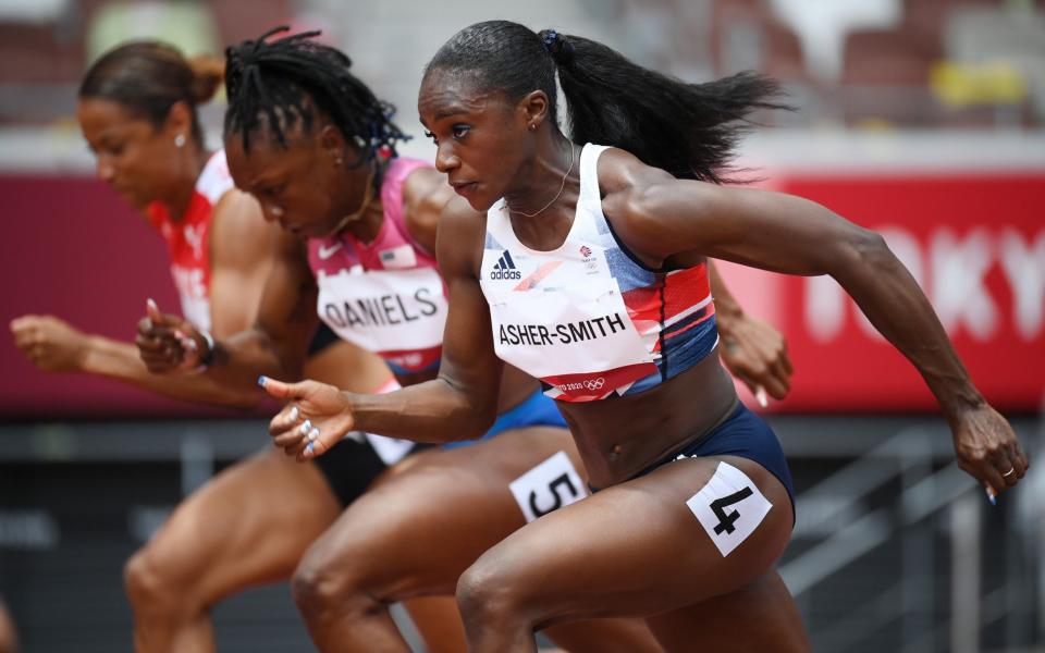 Dina Asher-Smith of Great Britain competes during round one of the Women's 100m heats - Matthias Hangst/Getty Images