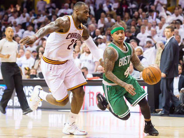 LeBron James and Isaiah Thomas turn the corner. (Getty Images)