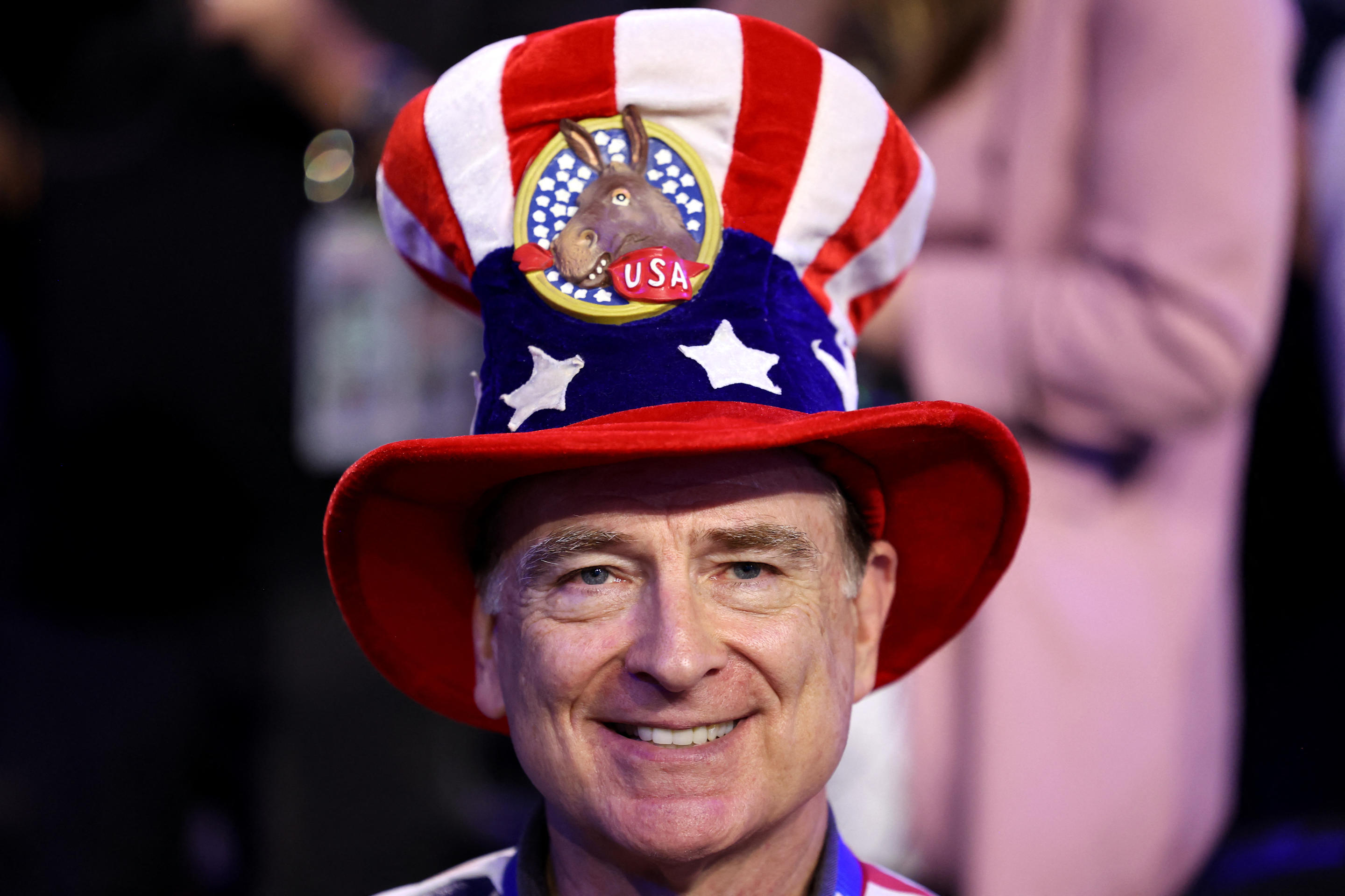 A delegate smiles on the first day of the Democratic National Convention in Chicago. (Charly Triballeau/AFP via Getty Images)