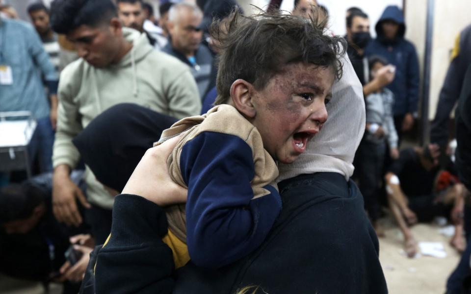 A boy injured during an Israeli air strike on al-Maghazi refugee camp