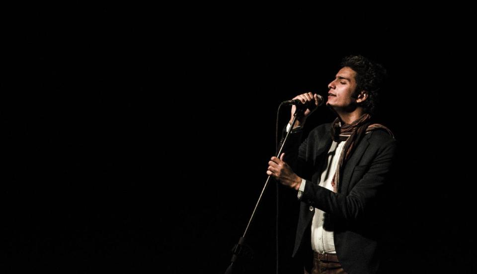 In this Sunday, Oct. 20, 2013, photo provided by Mesh Mesh, Egyptian singer Mohamed Mohsen performs during his concert at a theater in Cairo, Egypt. Mohsen, known for his anti-government songs, said Saturday, March 15, 2014, that Egyptian authorities stopped from performing at an arts festival attended by interim President Adly Mansour and military chief Field Marshal Abdel-Fattah El-Sissi for "security concerns." (AP Photo/Mesh Mesh)