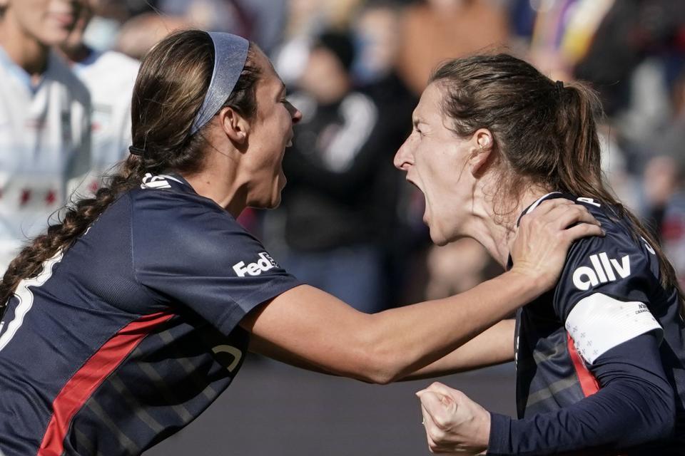 Washington Spirit’s Andi Sullivan, right, celebrates with Ashley Hatch after scoring on a penalty kick during NWSL Championship soccer match against the Chicago Red Stars, Saturday, Nov. 20, 2021, in Louisville, Ky. | Jeff Dean, Associated Press