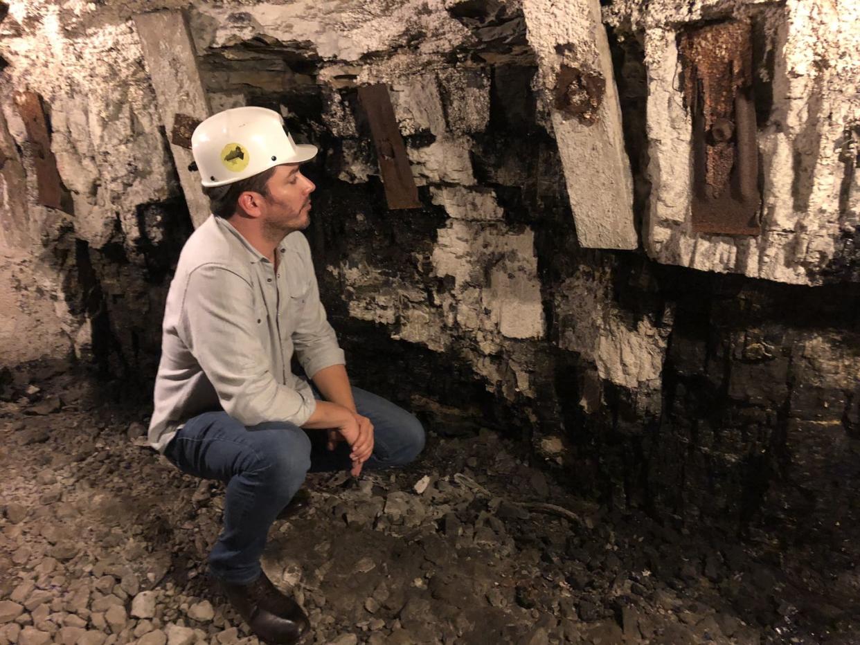 power trip director jonathan scott inspects the wall of a former coal mine in lynch, kentucky