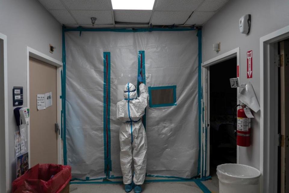 A medical staff member exits the Covid-19 intensive care unit at a hospital in Houston.