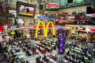 <p>The food court of Canal Walk, one of the largest shopping centers in the suburbs of Cape Town. Adult obesity is more common globally than malnutrition, and the worldwide prevalence of obesity more than doubled between 1980 and 2014. According to the WHO data, there are around 1.9 billion adults overweight, of those 600 million are considered obese. (Photograph by Silvia Landi) </p>