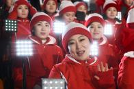 <p>Members of the North Korean cheering band wave ahead of the opening ceremony of the Pyeongchang 2018 Winter Olympic Games at the Pyeongchang Stadium on February 9, 2018. </p>