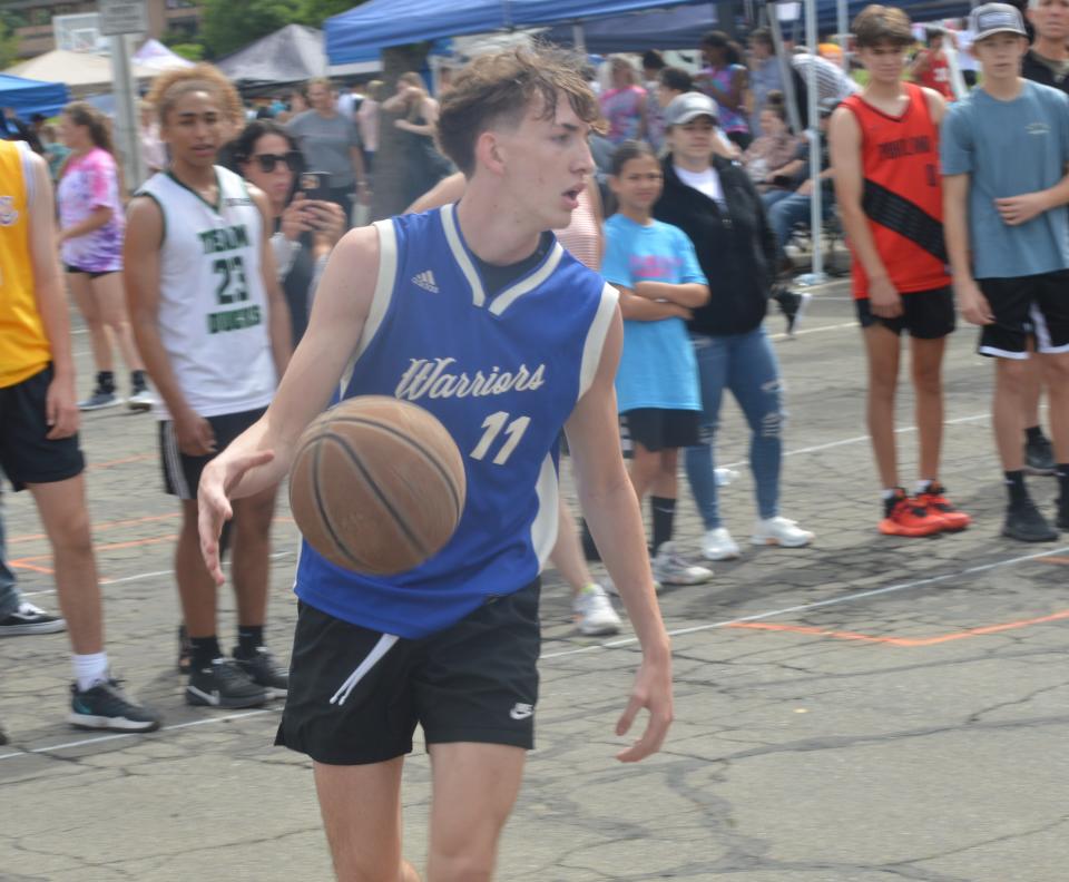 Shasta incoming junior guard Carter Audino dribbles the ball while scanning the floor during the Redding 3-on-3 Tournament at the Redding Civic Auditorium parking lot on Saturday, June 4, 2022.