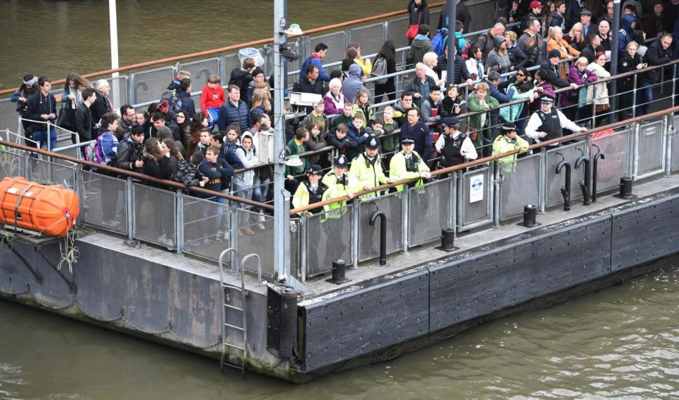 Shocked passers-by after a man was spotted in the river near Westminster Bridge (EPA)