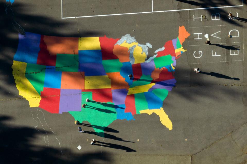 A map of the United States painted in a Kneeland Elementary schoolyard.