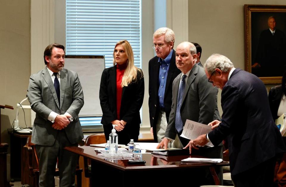 Alex Murdaugh, center, stands in a Colleton County courtroom on Friday, Dec. 9, 2022, with his lawyers. From left, Phil Barber, Maggie Fox, Jim Griffin and Dick Harpootlian.