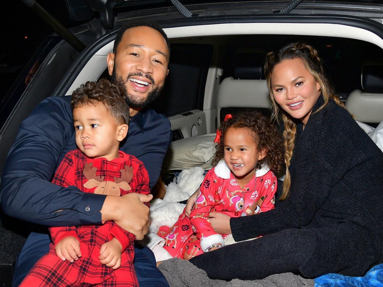 Miles Theodore Stephens, John Legend, Luna Simone Stephens, and Chrissy Teigen attend Netflix's "Jingle Jangle: A Christmas Journey" drive-in premiere at The Grove on November 13, 2020