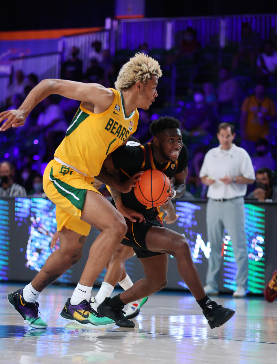 In a photo provided by Bahamas Visual Services, Arizona State guard Jay Heath drives on Baylor forward Jeremy Sochan (1) during an NCAA college basketball game at Paradise Island, Bahamas, Wednesday, Nov. 24, 2021. (Tim Aylen/Bahamas Visual Services via AP)