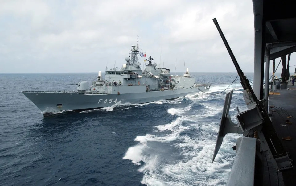 The Greek frigate<em> Psara</em> receives fuel during an underway replenishment with the fast combat support ship, <em>USS Seattle</em> (AOE-3) operating in support of Operation Enduring Freedom in May 2002. <em>U.S. Navy</em> PH1(NAO) Jim Hampshire