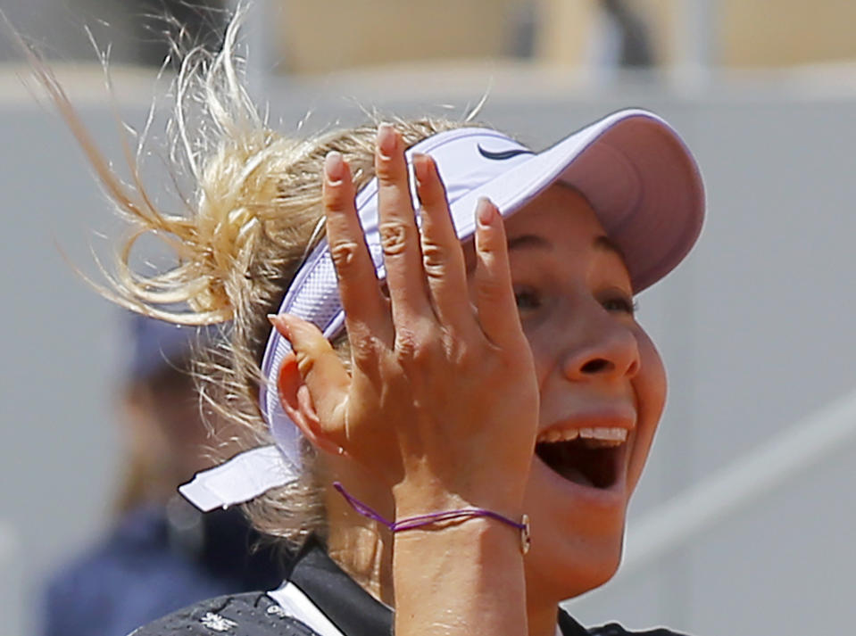 Amanda Anisimova of the U.S. celebrates winning her quarterfinal match of the French Open tennis tournament against Romania's Simona Halep in two sets, 6-2, 6-4, at the Roland Garros stadium in Paris, Thursday, June 6, 2019. (AP Photo/Michel Euler)