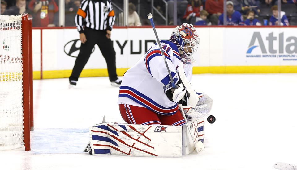 New York Rangers goaltender Igor Shesterkin (31) makes a save against the New Jersey Devils during the second period of an NHL hockey game Saturday, Nov. 18, 2023, in Newark, N.J. (AP Photo/Noah K. Murray)