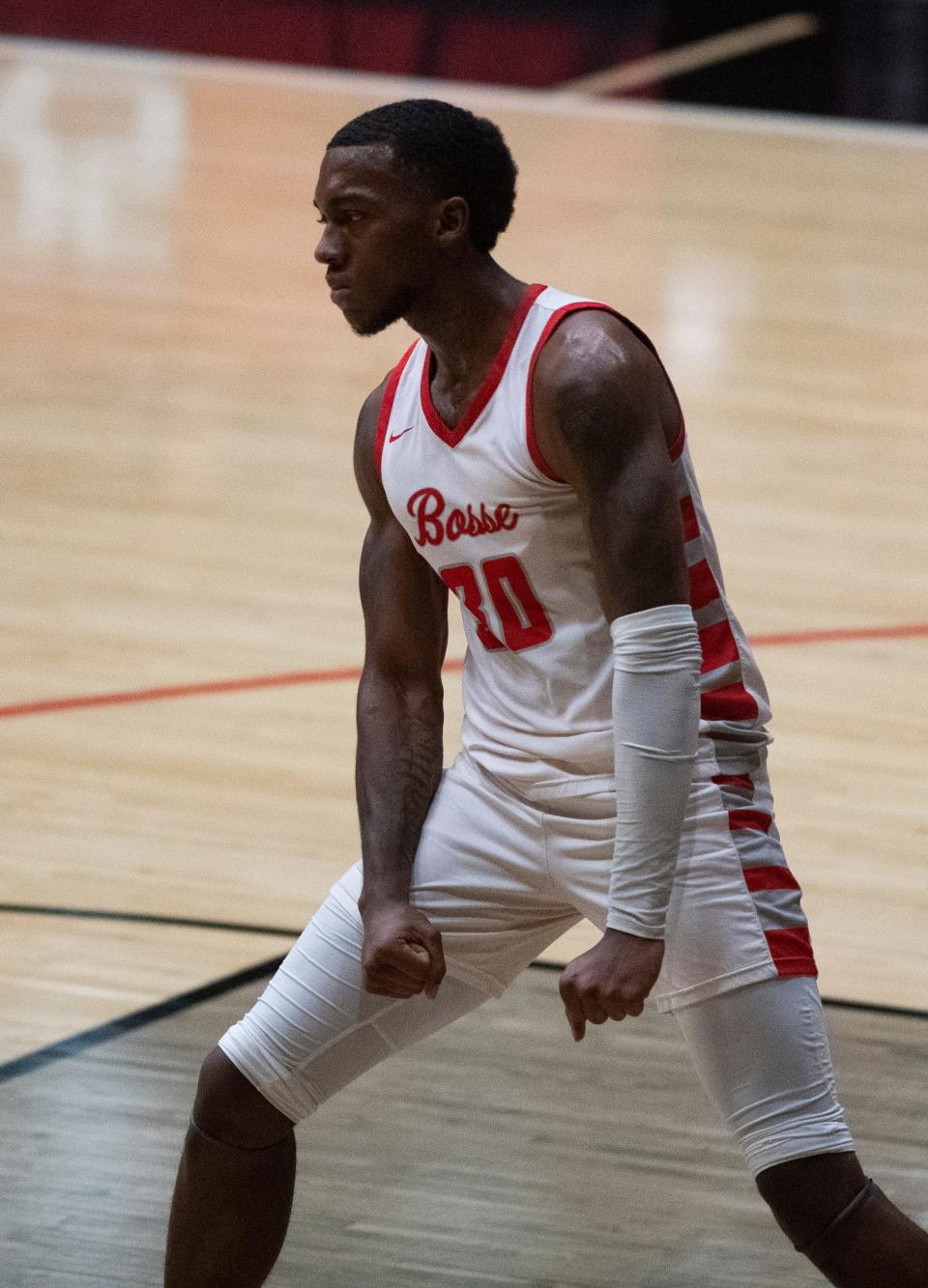 Bosse’s AP Mitchell (30) reacts after dunking the ball as the Bosse Bulldogs play the Southridge Raiders during the 2024 IHSAA Class 3A Boys Basketball Regional at Memorial Gym in Huntingburg, Ind., Saturday, March 9, 2024.