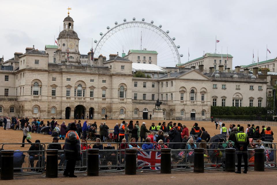 People gather on the day the coffin of Britain's Queen Elizabeth is transported from Buckingham Palace to the Houses of Parliament for her lying in state (REUTERS)