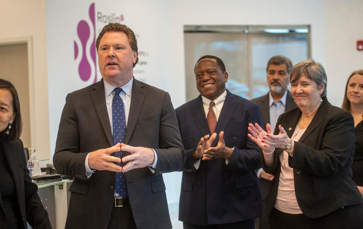 Patrick Lucy, left, CEO of RoslinCT USA, said Hopkinton "has been incredibly friendly to biotech." He praised Gov. Maura Healey's legislation aimed at strengthening the state's leadership in life sciences. Beside him are Town Manager Norman Khumalo and Select Board Chair Muriel Kramer.