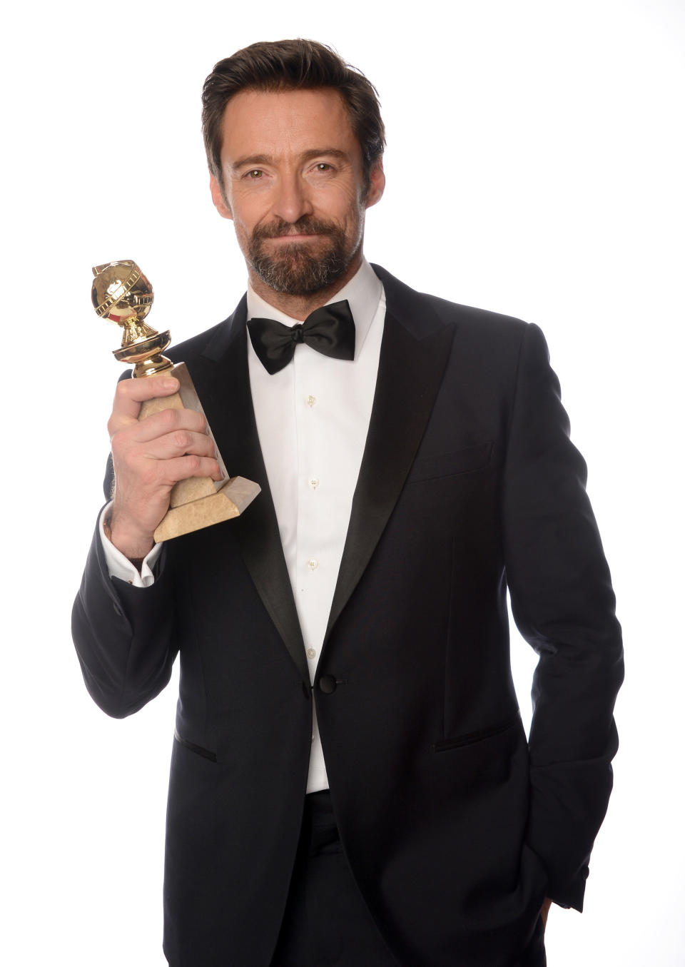 BEVERLY HILLS, CA - JANUARY 13:  Actor Hugh Jackman, winner of the 'Best Performance by an Actor in a Motion Picture - Comedy Or Musical Award for 'Les Miserables' poses for a portrait at the 70th Annual Golden Globe Awards held at The Beverly Hilton Hotel on January 13, 2013 in Beverly Hills, California.  (Photo by Dimitrios Kambouris/Getty Images)