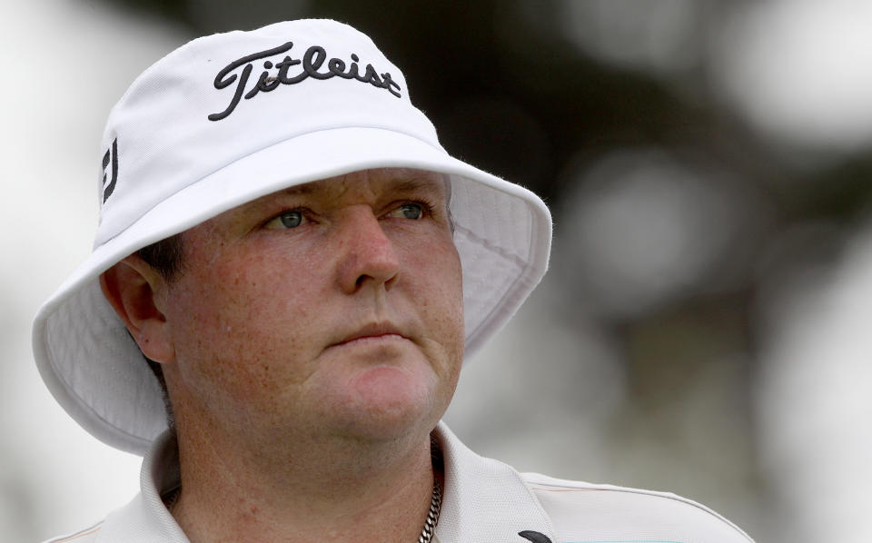 FILE - In this Nov. 10, 2011, file photo, Australia's Jarrod Lyle watches his ball on the 18th hole during the first round of the Australian Open golf tournament in Sydney. Lyle has died after a long struggle with cancer. He was 36. "It breaks my heart to tell everyone that Jarrod is no longer with us," the golfer's wife, Briony Lyle, said in a statement Thursday, Aug. 9, 2018. (AP Photo/Rob Griffith, File)