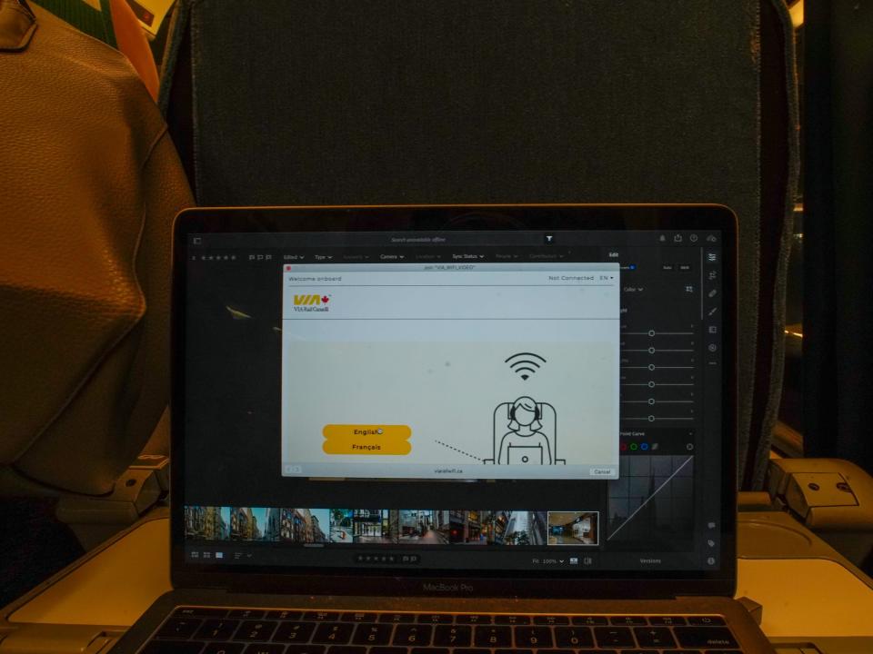 A laptop with a WiFi setup on the screen on a table