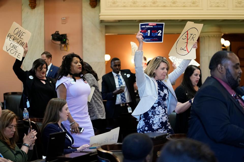 Ohio House Minority Leader Allison Russo leads a chant May 10 on the Ohio House floor with fellow Democrat representatives chanting “one person one vote” inside the Statehouse following a vote on whether to create an August special election for a resolution that would increase the voter threshold to 60% for constitutional amendments.