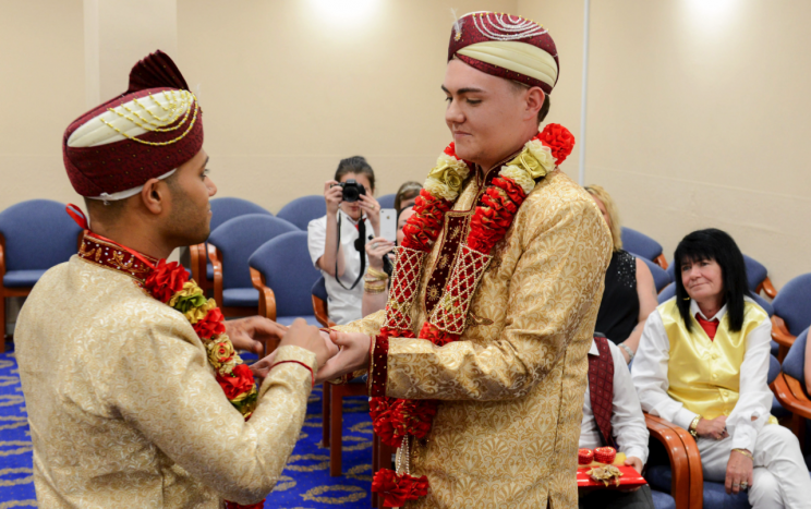 The ceremony was witnessed by both their families (Picture: Caters)