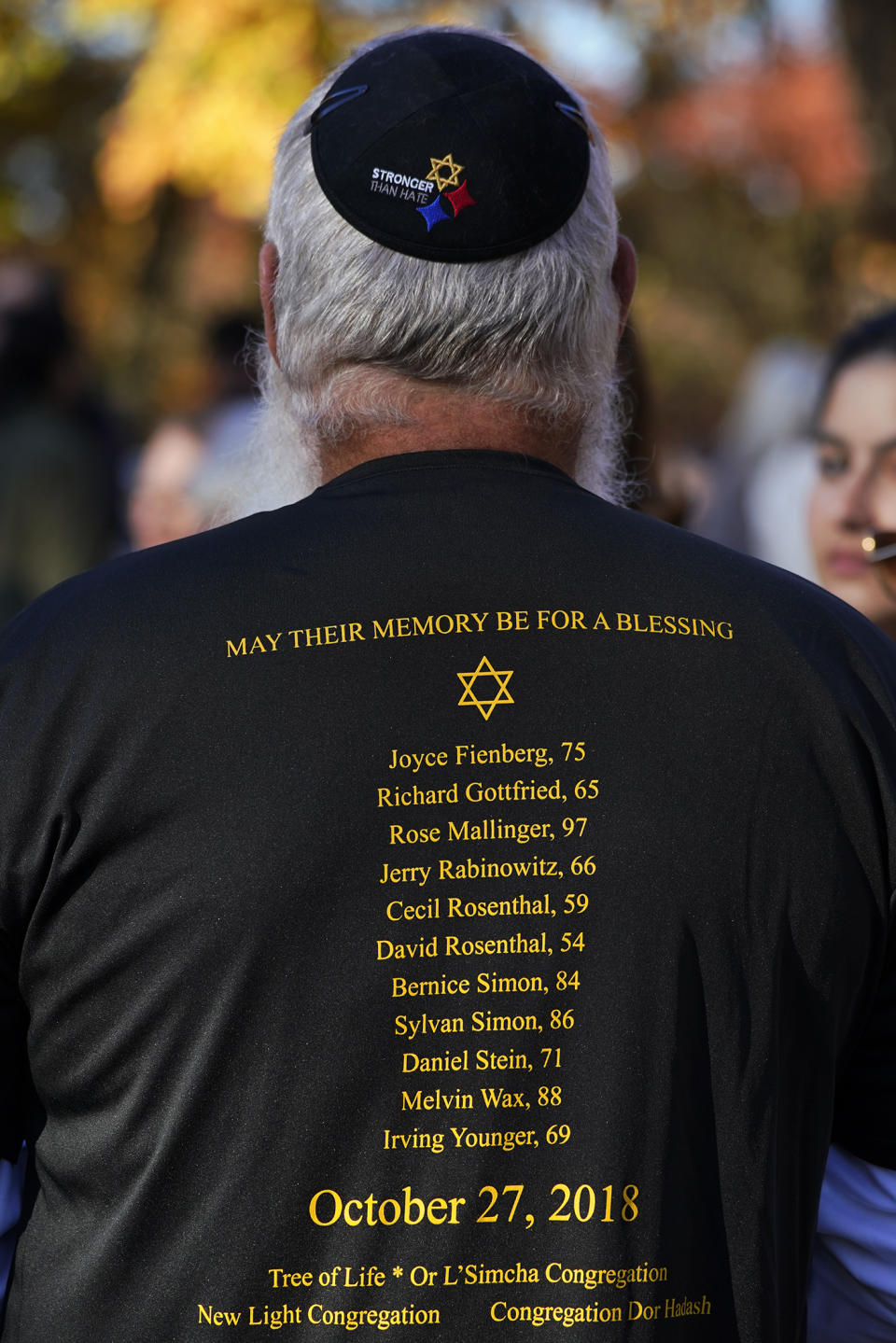 FILE - Kris Kepler, of Pittsburgh, attends a commemoration ceremony, Oct. 27, 2022, in Schenley Park, in memory of the 11 worshippers killed four years ago when a gunman opened fire at the Tree of Life synagogue in the Squirrel Hill neighborhood in Pittsburgh. The long-delayed capital murder trial of Robert Bowers in the 2018 Pittsburgh synagogue massacre will begin with jury selection beginning April 24, 2023, a federal judge has ruled. (AP Photo/Gene J. Puskar, File)