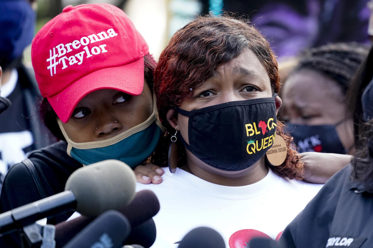 Tamika Palmer, right, the mother of Breonna Taylor, listens to a news conference in Louisville, Ky. (Darron Cummings/AP)