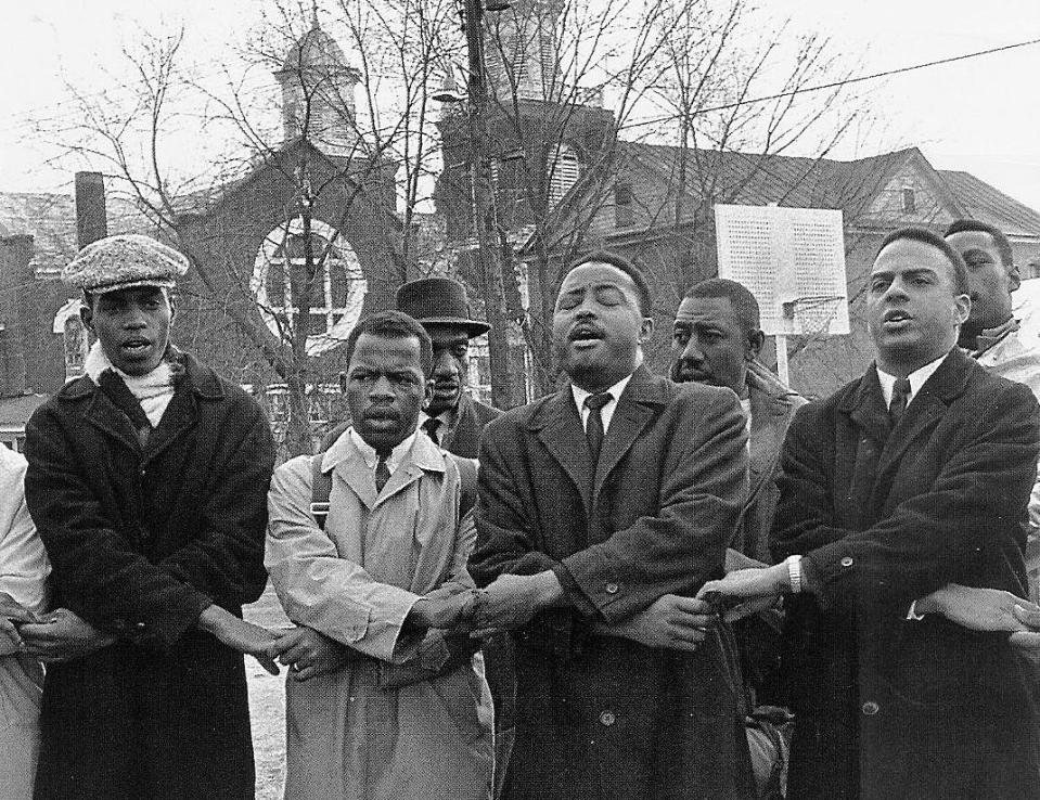 Bob Mants, John Lewis, Hosea Williams and Andrew Young sing in front of Brown's Chapel AME Church in Selma on March 7, 1965.
