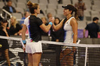 Maria Sakkari, left, of Greece, and Jessica Pegula, right, meet at the net after Sakkari defeated Pegula in their match in the WTA Finals tennis tournament in Fort Worth, Texas, Monday, Oct. 31, 2022. (AP Photo/Tim Heitman)