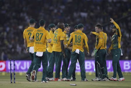 South Africa's players celebrate the dismissal of India's Ambati Rayudu during their second Twenty20 cricket match in Cuttack, India, October 5, 2015. REUTERS/Danish Siddiqui
