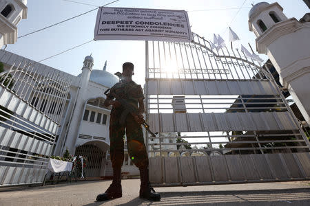 A member of the Civil Defence Force keeps watch outside Negombo Grand Mosque, following a string of suicide attacks on churches and luxury hotels, in Negombo, Sri Lanka, April 25, 2019. REUTERS/Athit Perawongmetha