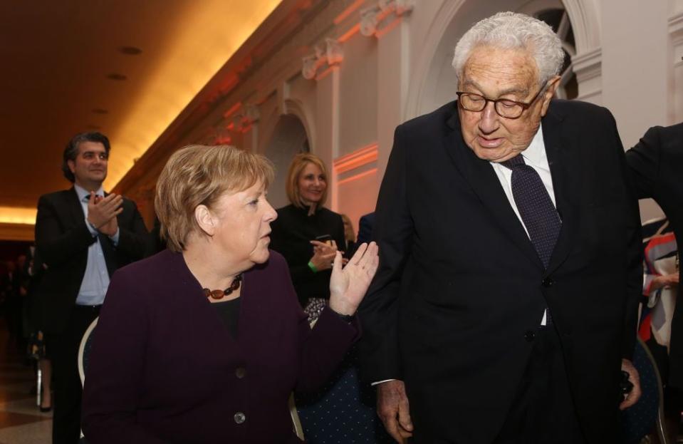 BERLIN, GERMANY - JANUARY 21: German Chancellor Angela Merkel (CDU, L) arrives with former United States Secretary of State and National Security Advisor Henry Kissinger for the ceremony for the Henry A. Kissinger Prize on January 21, 2020 in Berlin, Germany. The annual prize is awarded by the American Academy in Berlin for 