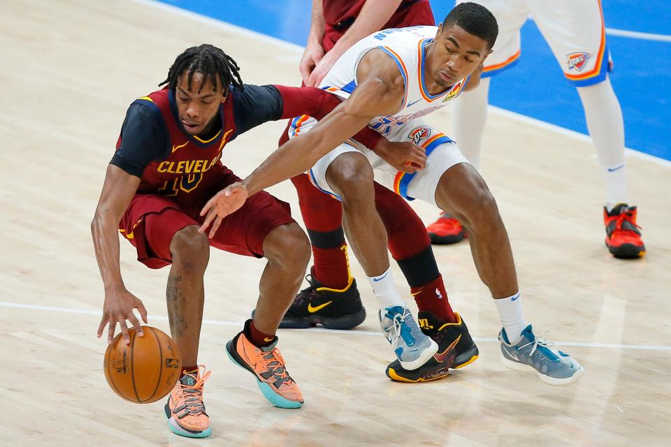 Oklahoma City's Theo Maledon (11) defends Cleveland's Darius Garland (10) during an NBA basketball game between the Oklahoma City Thunder and the Cleveland Cavaliers at Chesapeake Energy Arena in Oklahoma City, Thursday, April 8, 2021. 