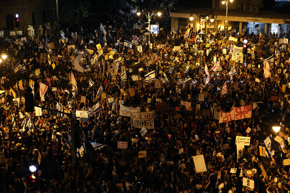 Thousands protest against Israel's Prime Minister Benjamin Netanyahu in front of his official residence in Jerusalem, Saturday, Aug. 8, 2020. (AP Photo/Ariel Schalit)