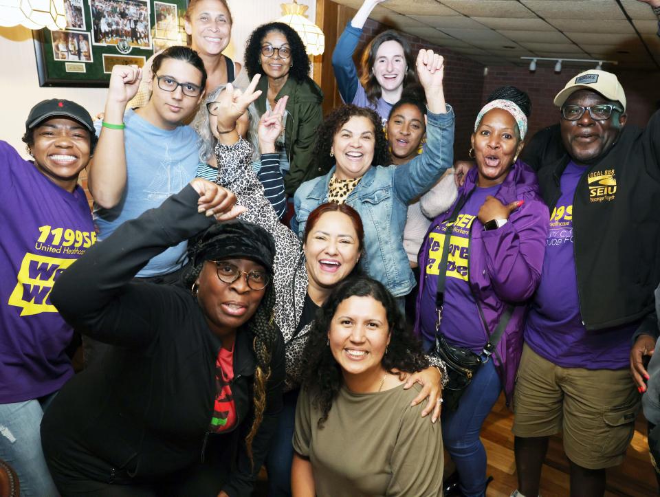 Brockton City Councilor-at-large Rita Mendes, bottom center, celebrates at Home Cafe after winning the Democratic nomination for the 11th Plymouth District state representative seat on Tuesday, Sept. 6, 2022.