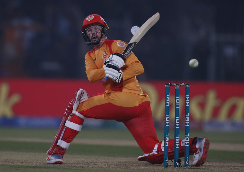 Colin Munro of Islamabad United hits boundary against the Lahore Qalandars during a Pakistan Super League T20 match in Lahore, Pakistan, Wednesday, March 4, 2020. (AP Photo/K.M. Chaudary)