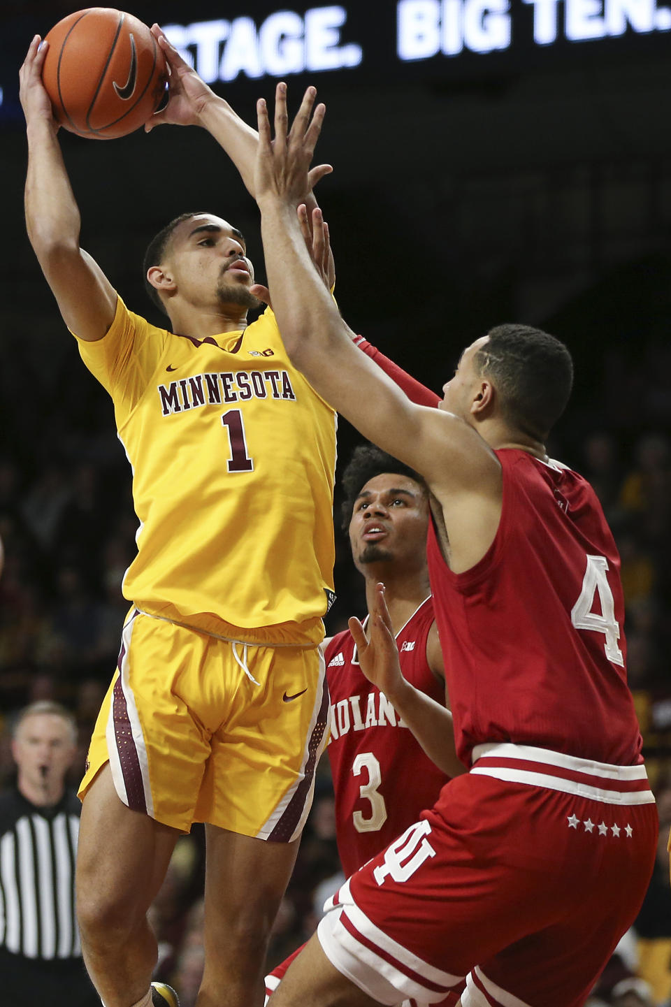 Minnesota's Tre' Williams shoots as Indiana's Trayce Jackson-Davis defends during the first half of an NCAA college basketball game Wednesday, Feb. 19, 2020, in Minneapolis. (AP Photo/Stacy Bengs)