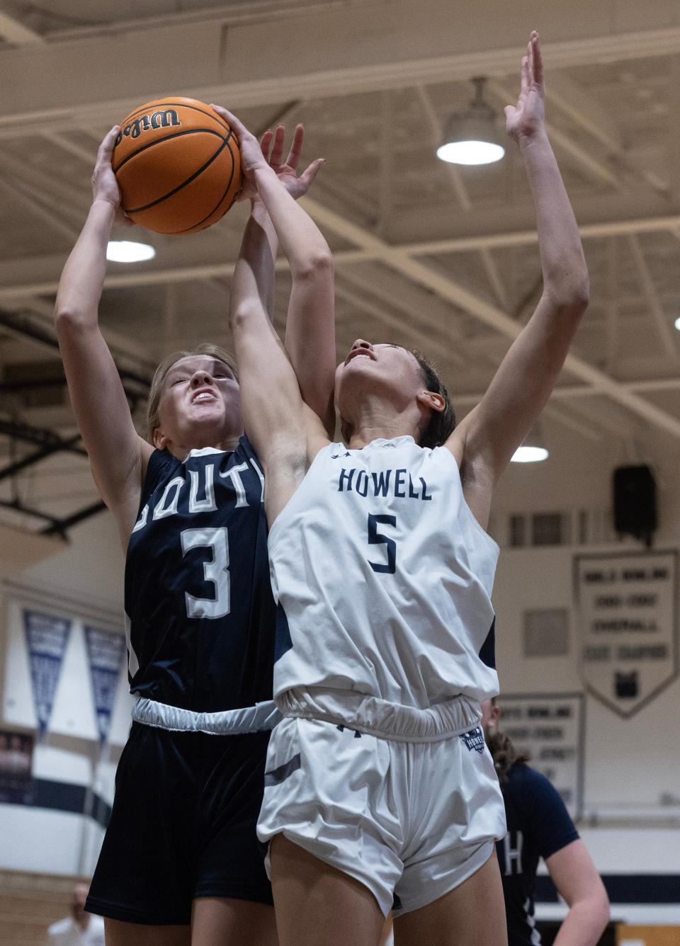Midd South Amanda Paterno and Howell Kiera McKown battle for a rebound. Howell Girls Basketball defeats Middletown South to advance in NJSIAA play on February 21, 2023 in Howell NJ. 