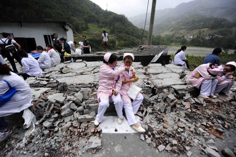 Medical personnel rest in disaster-hit Ya'an, Sichuan province, on April 21, 2013