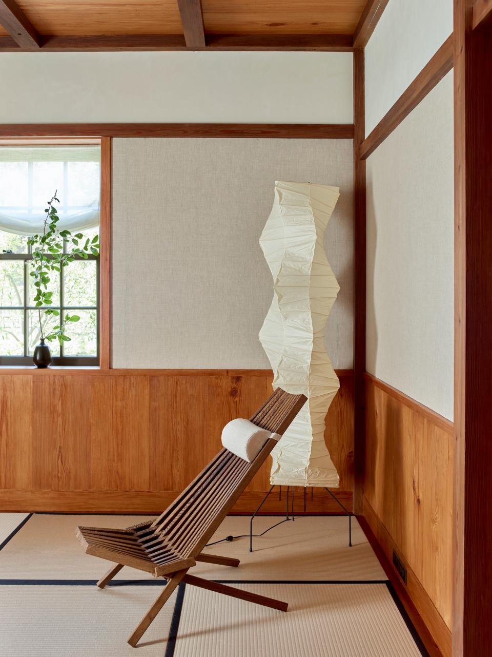 An Akari floor lamp by Isamu Noguchi stands in the corner.