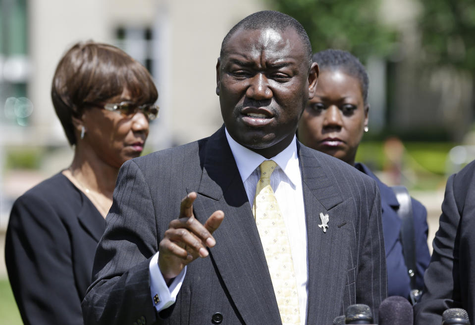 FILE - Benjamin Crump, center, attorney for Trayvon Martin's family, speaks to members of the media after a hearing for George Zimmerman with Marion Evans, left, Trayvon Martin's grandmother and Sybrina Fulton, right, Trayvon Martin's mother, at the Seminole County Criminal Justice Center, on May 28, 2013, in Sanford, Fla. In the decade since Martin's killing, Crump has gone from being a Florida lawyer little known outside of the state to America's most famous social-justice attorney. He has represented families whose relatives have died at the hands of law enforcement or vigilantes, including Michael Brown, Breonna Taylor and George Floyd. (AP Photo/John Raoux, File)
