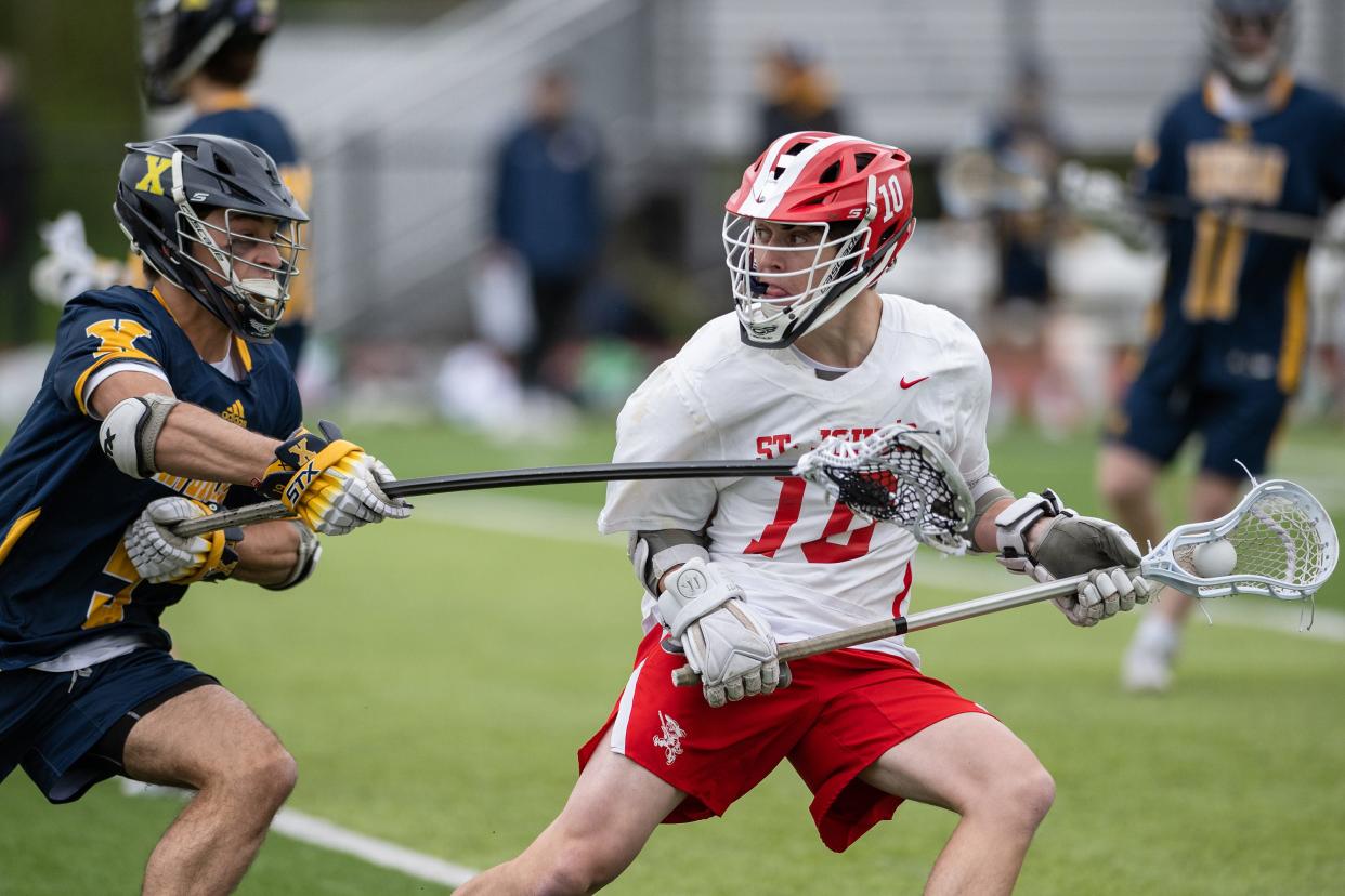 St. John's Matt Lemay, right, looks to pass during a game last season.