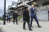 FILE - In this Saturday, Oct. 23, 2021, file photo, Buffalo mayoral candidate India Walton, front left, and New York Sen. Sean Ryan take part in a walking tour of local businesses in Buffalo, N.Y. The race for mayor of Buffalo has four-term incumbent Byron Brown relying on a write-in campaign to fend off a challenge from newcomer Walton, who identifies herself as a democratic socialist. (AP Photo/Joshua Bessex, File)