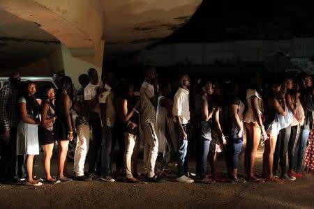 Fans of Nigerian pop star Wizkid queue to enter his concert at a football stadium in Bamako, Mali, November 15, 2015. REUTERS/Joe Penney