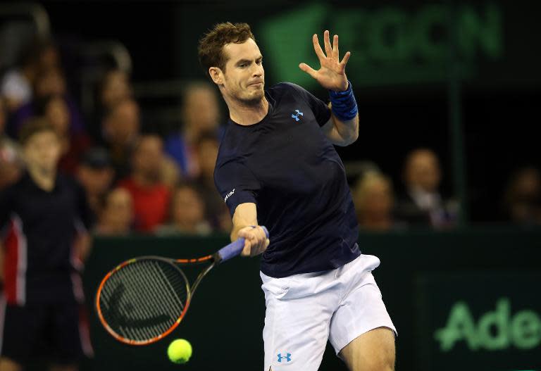 Great Britain's Andy Murray plays a shot during a Davis Cup singles tennis match against Donald Young of US at the Emirates Arena in Glasgow on March 6, 2015