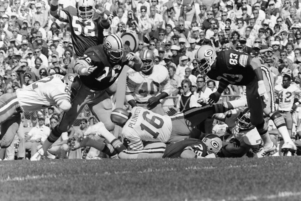 Cathedral Prep graduate Mike McCoy of the Green Bay Packers (76) tackles San Francisco 49ers quarterback Jim Plunkett during a Sept. 1,2 1976, NFL game at Lambeau Field.