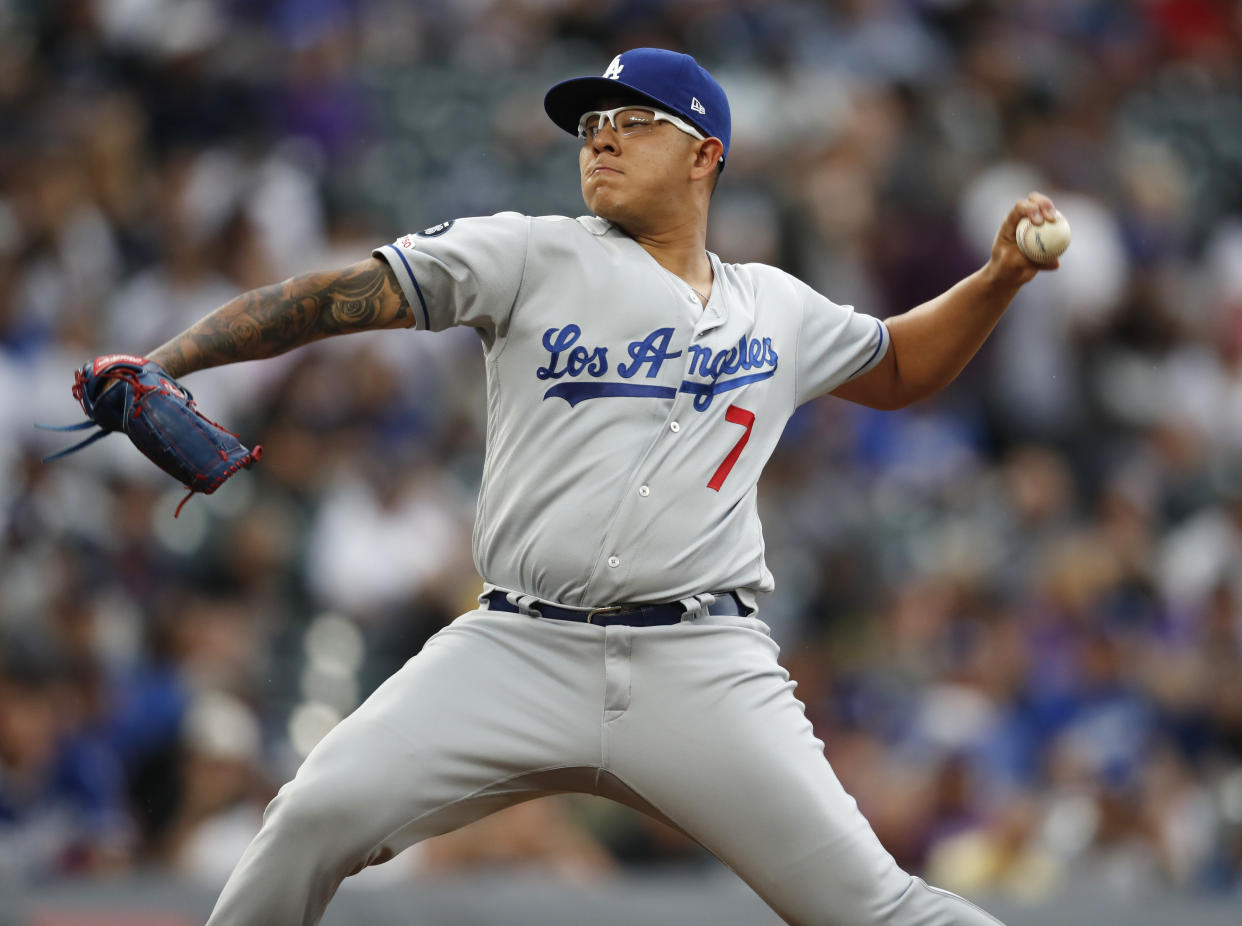 Los Angeles Dodgers starting pitcher Julio Urias works against the Colorado Rockies in the first inning of a baseball game Tuesday, July 30, 2019, in Denver. (AP Photo/David Zalubowski)